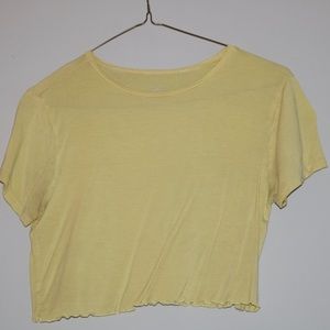 yellow tee shirt slightly cropped